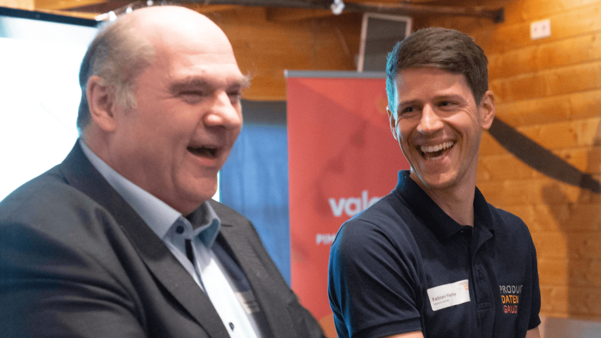 zwei lachende Gesichter auf der PDG